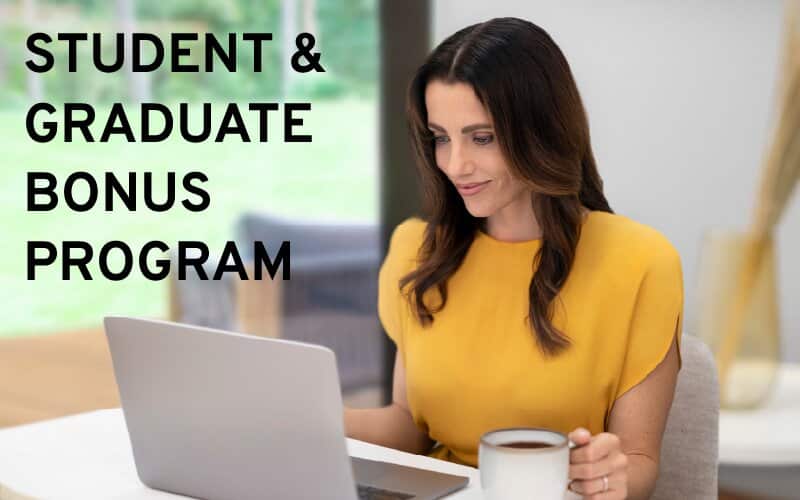 Woman in yellow shirt using a laptop with a cup of coffee; text reads "Student & Graduate Bonus Program".