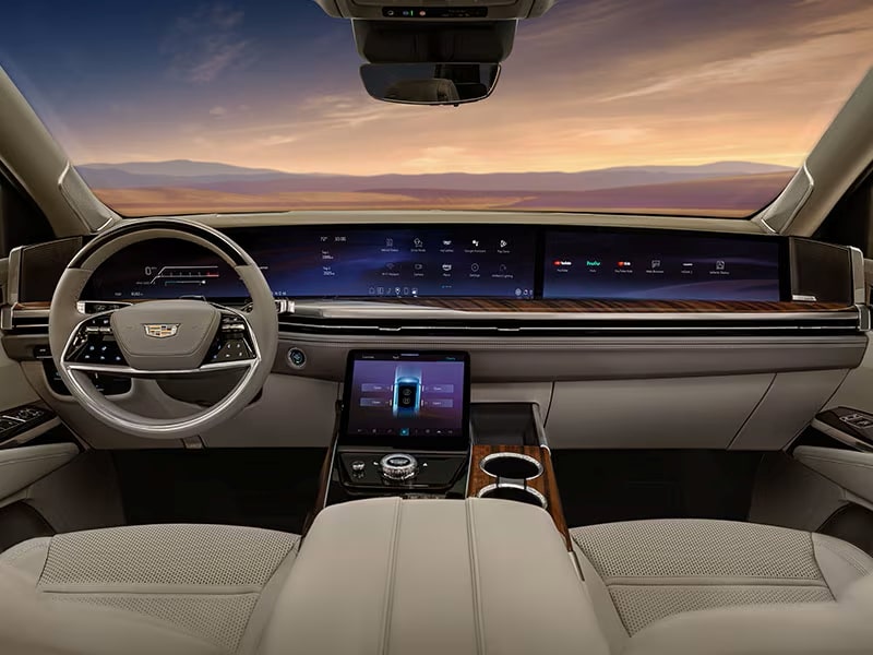 Luxury car interior featuring a digital dashboard, sleek steering wheel, and console with touchscreens.